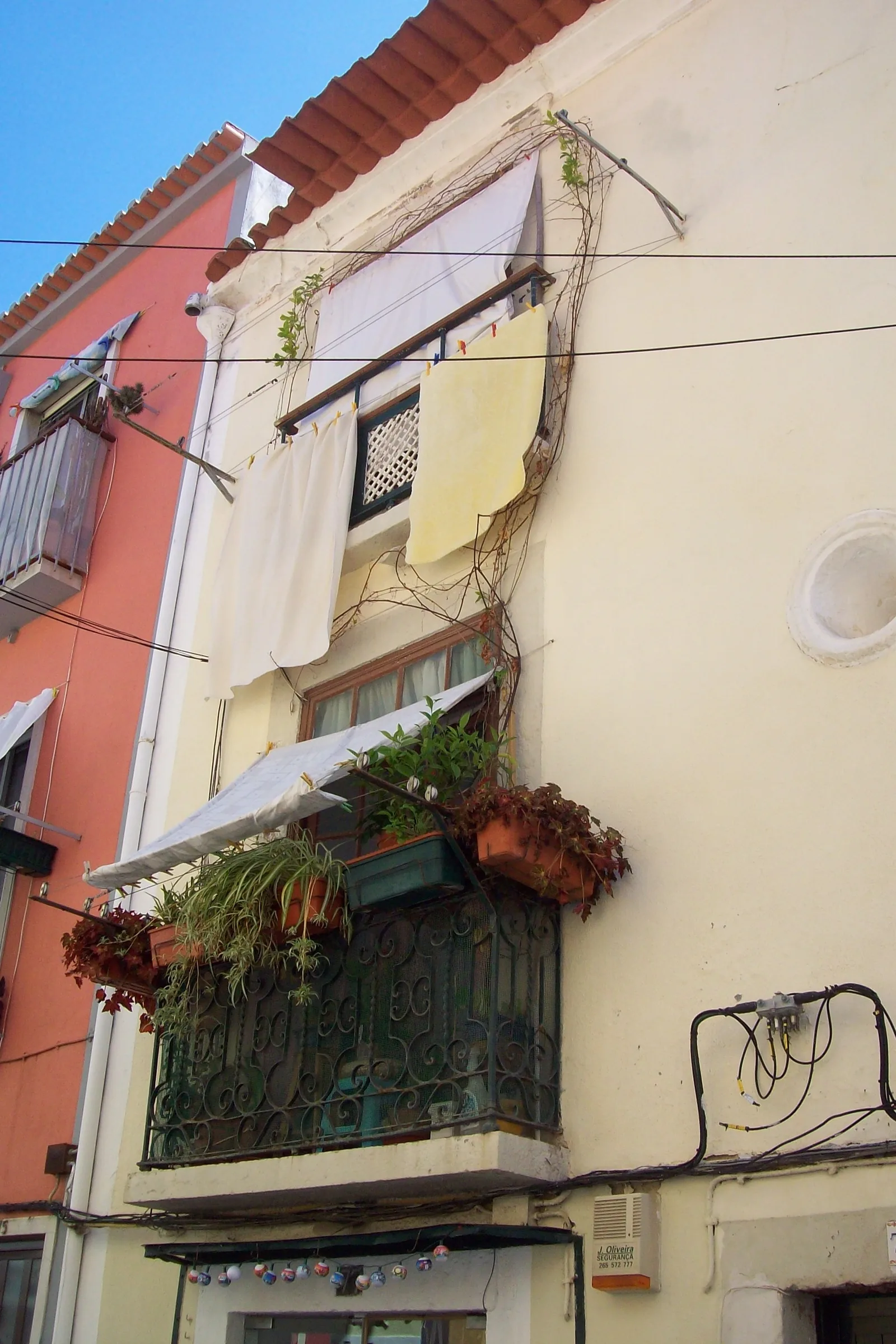 Characteristic balcony in Troino quarter — the oldest fishing district